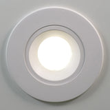 WHITE 4" slim LED gimbal downlight with selectable CCT for sleek, adjustable directional lighting.